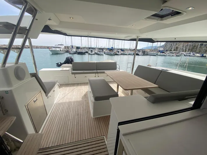 Luna Yacht Photos Pics Spacious deck of 2020 Fountaine Pajot Saona 47 catamaran with marina view.