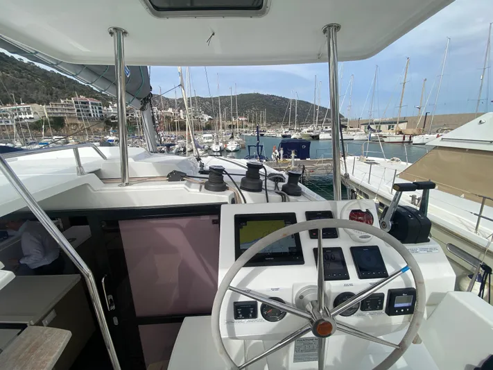 Luna Yacht Photos Pics Cockpit view of 2020 Fountaine Pajot Saona 47 catamaran docked at marina.