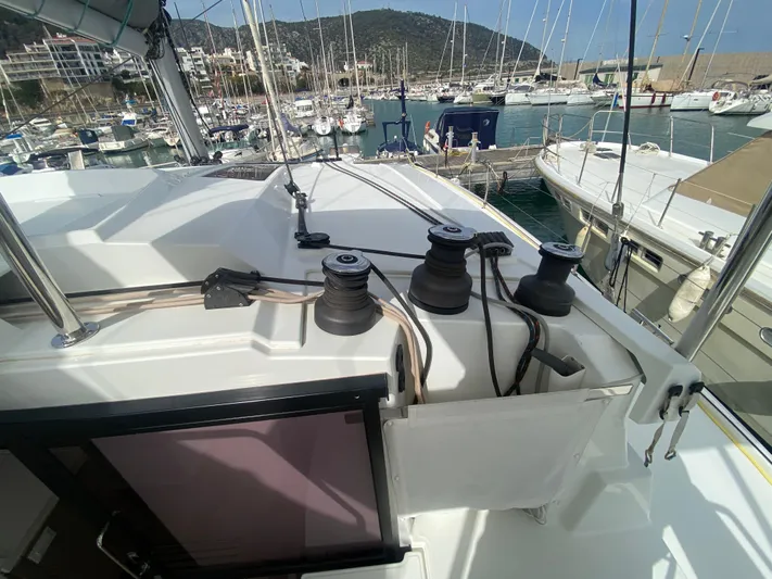 Luna Yacht Photos Pics Fountaine Pajot Saona 47 yacht deck with winches, docked in marina, 2020 model.