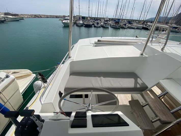 Luna Yacht Photos Pics 2020 Fountaine Pajot Saona 47 yacht helm station with marina view.