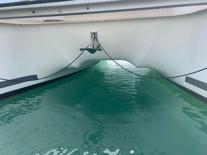 Luna Yacht Photos Pics Fountaine Pajot Saona 47 catamaran hull over turquoise water, 2020 model.