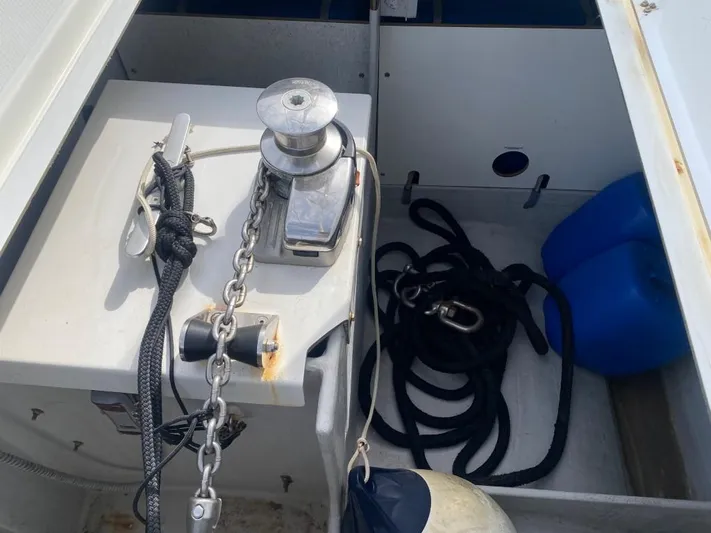 Luna Yacht Photos Pics Anchor locker of 2020 Fountaine Pajot Saona 47 with chain, rope, and blue container.
