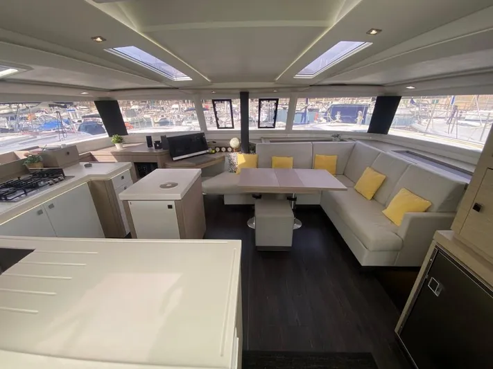 Luna Yacht Photos Pics Luxurious interior of 2020 Fountaine Pajot Saona 47 catamaran with modern furnishings and ample seating.