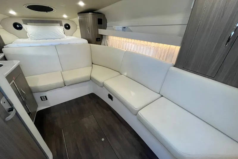 Then Again Yacht Photos Pics Interior of 2021 Regal 33 XO yacht with white seating and modern design.