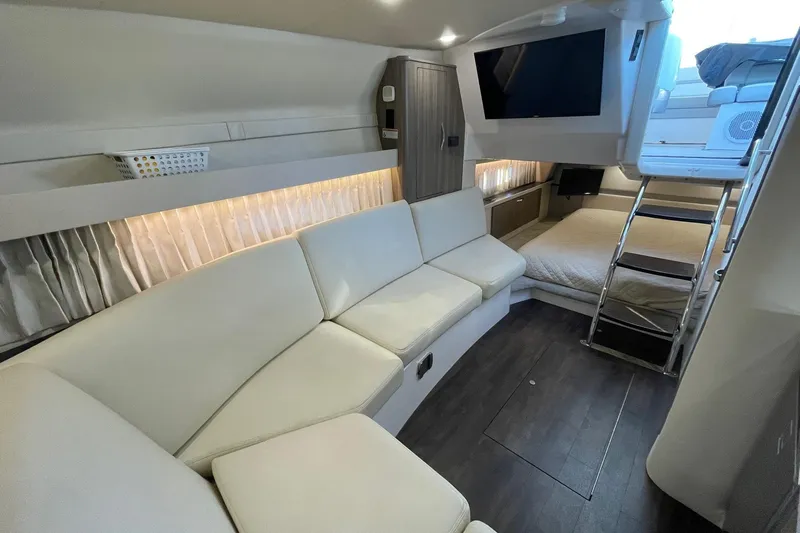 Then Again Yacht Photos Pics Luxurious interior of 2021 Regal 33 XO yacht with modern seating and entertainment area.