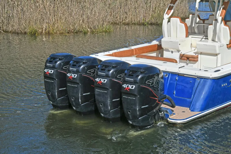  Yacht Photos Pics 2016 Scout 420 LXF boat with four powerful outboard engines in water.