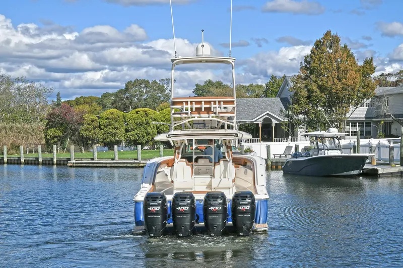  Yacht Photos Pics 2016 Scout 420 LXF boat with four engines on a calm waterway.