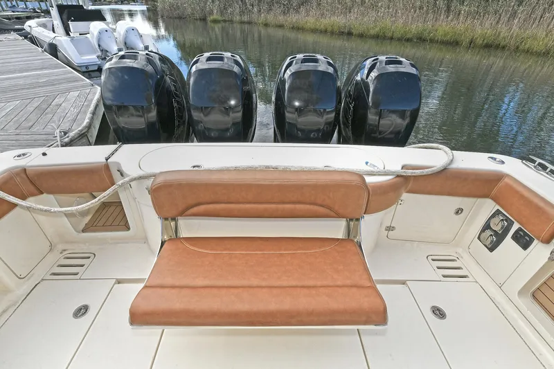  Yacht Photos Pics 2016 Scout 420 LXF boat with four powerful outboard engines and tan seating.