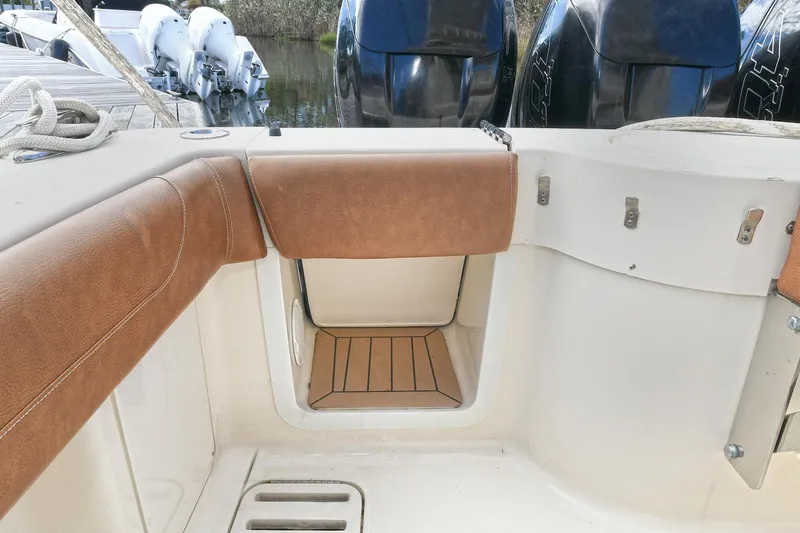  Yacht Photos Pics 2016 Scout 420 LXF boat interior with brown seating and storage compartment.
