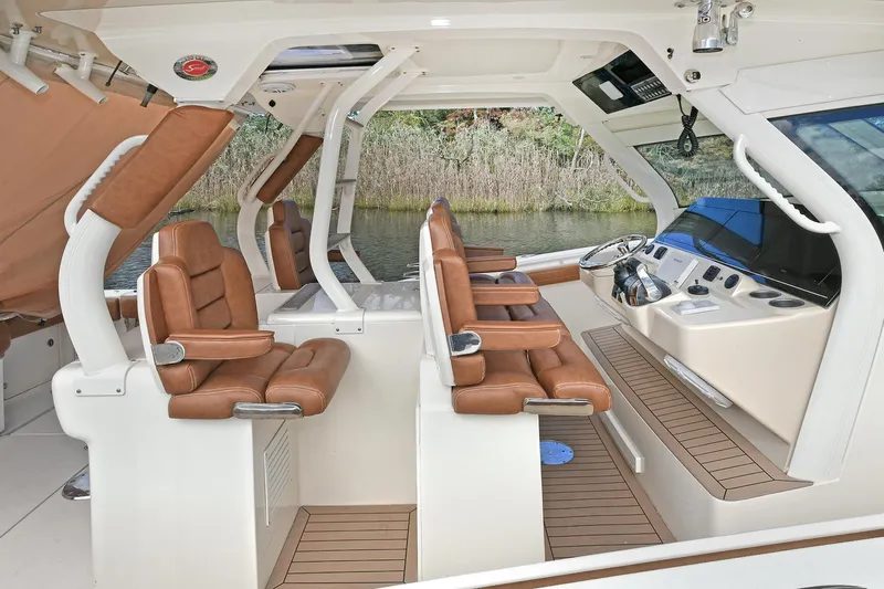  Yacht Photos Pics 2016 Scout 420 LXF boat interior with luxurious leather seating and modern dashboard.