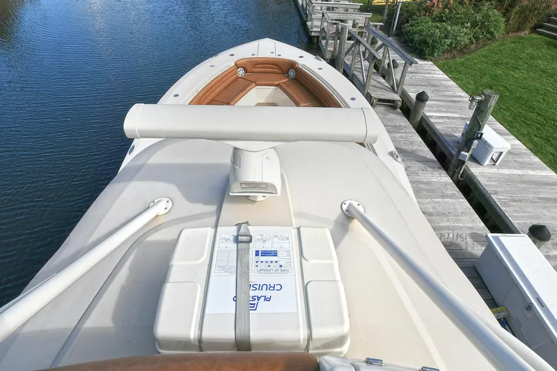  Yacht Photos Pics 2016 Scout 420 LXF boat docked, showcasing bow and deck features.