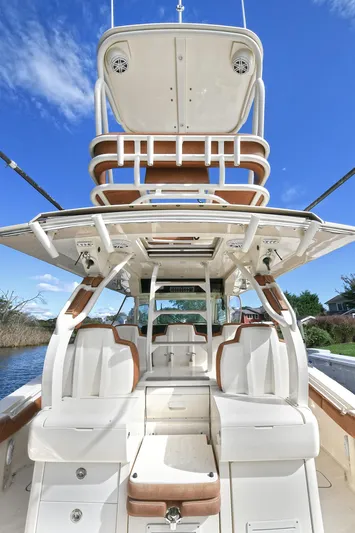  Yacht Photos Pics 2016 Scout 420 LXF boat with luxurious seating and sleek design under a clear blue sky.