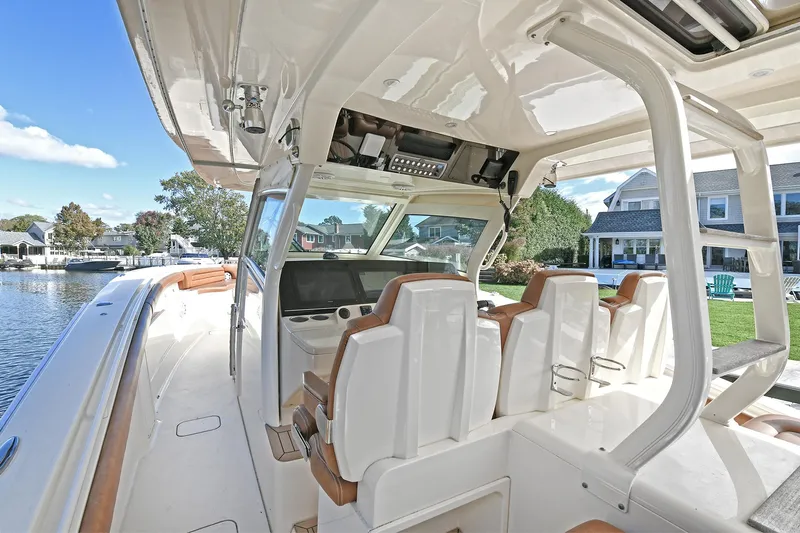  Yacht Photos Pics 2016 Scout 420 LXF boat interior with luxurious seating and modern dashboard.