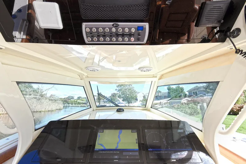  Yacht Photos Pics 2016 Scout 420 LXF boat dashboard with navigation screens and control panel.