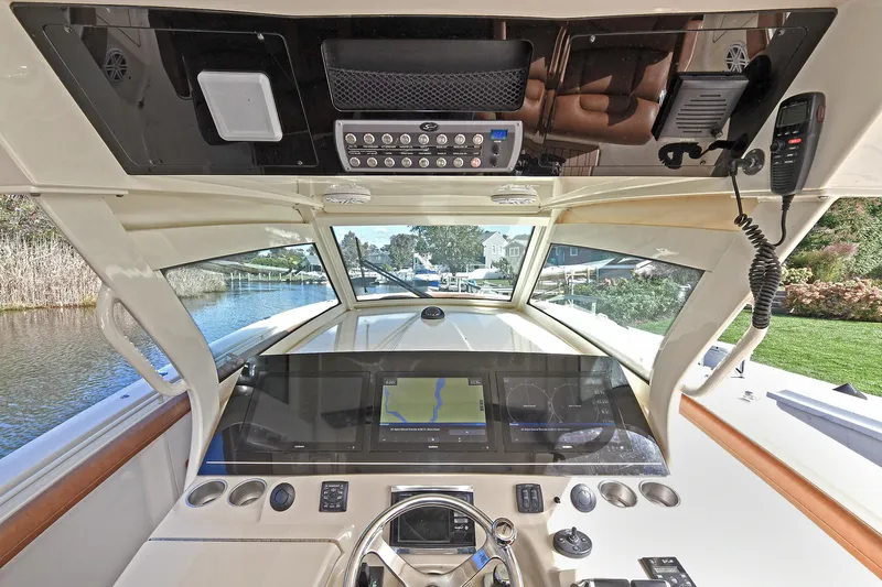  Yacht Photos Pics Interior view of 2016 Scout 420 LXF boat cockpit with navigation system.