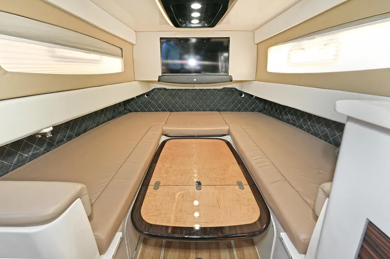  Yacht Photos Pics Luxurious interior of 2016 Scout 420 LXF boat with seating and table.