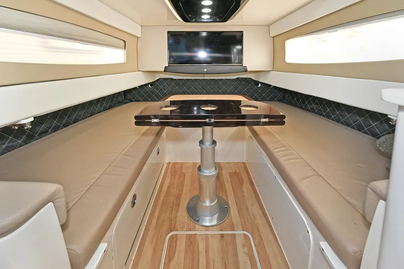  Yacht Photos Pics 2016 Scout 420 LXF cabin interior with seating, table, and TV.