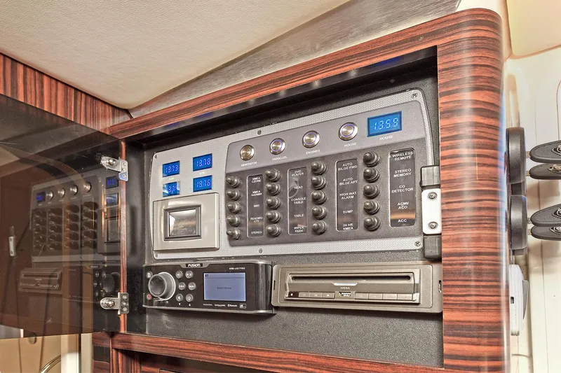  Yacht Photos Pics Control panel of 2016 Scout 420 LXF boat with electronic displays and switches.