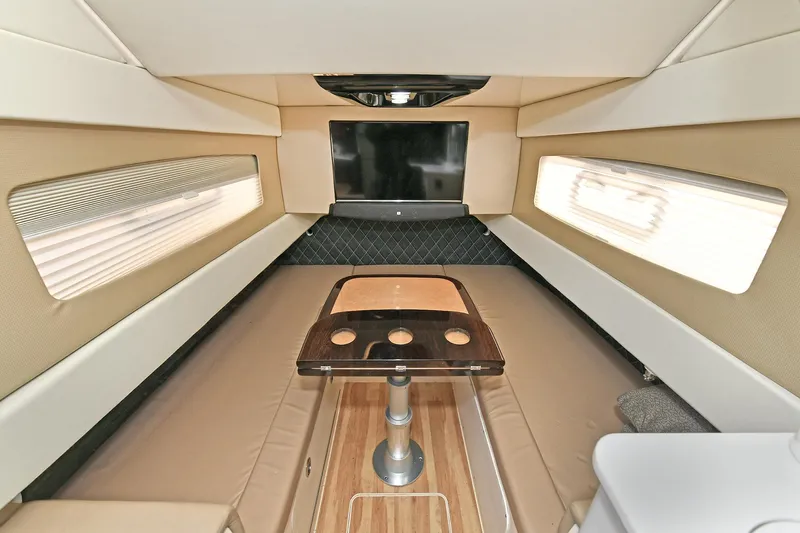  Yacht Photos Pics Luxurious interior of 2016 Scout 420 LXF boat with seating and table.