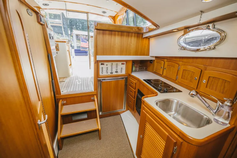 Mm Yacht Photos Pics Luxurious 2010 San Juan SJ40FB IPS yacht interior with wooden cabinetry and modern kitchen amenities.