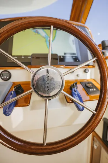 Mm Yacht Photos Pics Steering wheel of 2010 San Juan SJ40FB IPS boat with navigation display.
