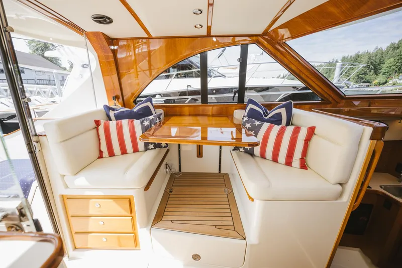 Mm Yacht Photos Pics Luxurious 2010 San Juan SJ40FB IPS yacht interior with elegant seating and nautical-themed cushions.