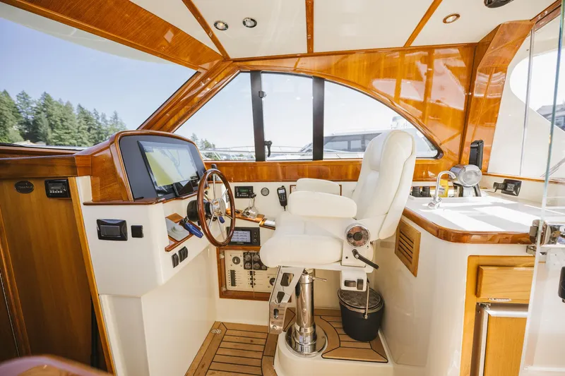 Mm Yacht Photos Pics Luxurious 2010 San Juan SJ40FB IPS yacht interior with polished wood and modern controls.
