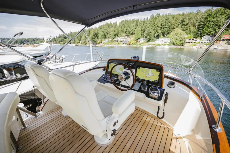 Mm Yacht Photos Pics Helm of 2010 San Juan SJ40FB IPS yacht with dual seats and navigation equipment.