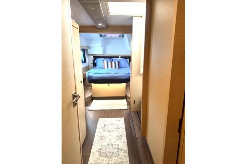 Refaire Yacht Photos Pics Interior of 2016 Fountaine Pajot Lucia 40 catamaran cabin with bed and modern decor.