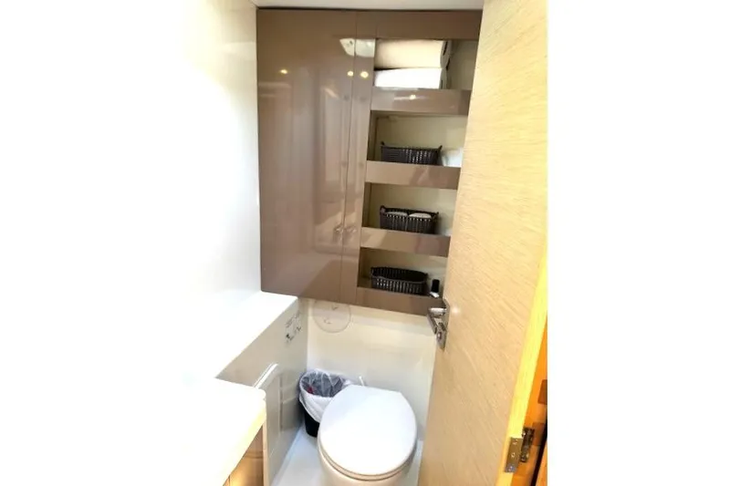 Refaire Yacht Photos Pics Bathroom interior of 2016 Fountaine Pajot Lucia 40 catamaran, featuring modern fixtures and storage shelves.