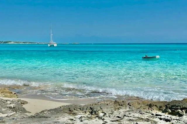 Refaire Yacht Photos Pics Sailboat Fountaine Pajot Lucia 40, 2016, anchored in clear turquoise waters near rocky shore.