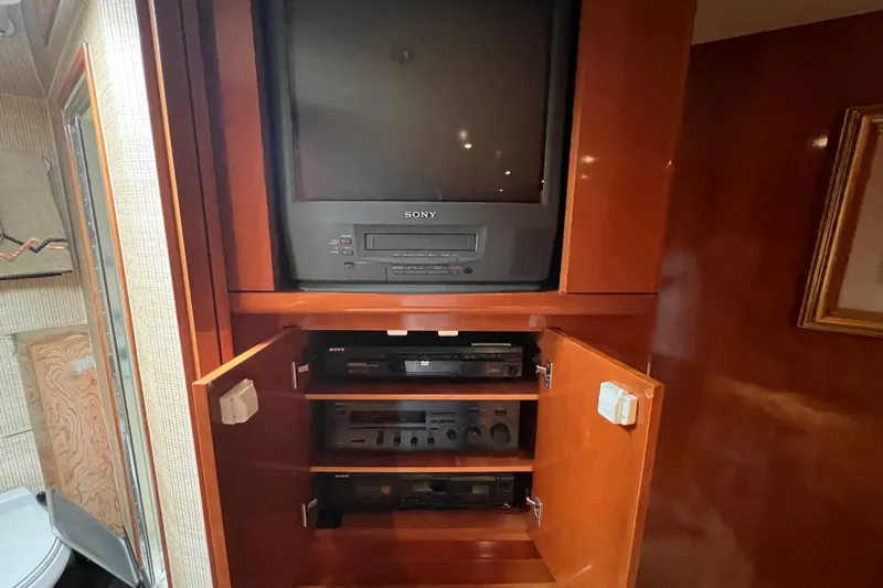 Renegade Yacht Photos Pics 2001 Hatteras 65 Convertible yacht entertainment system with vintage Sony TV and audio equipment.