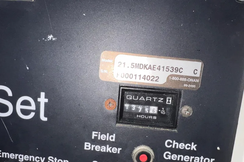 Renegade Yacht Photos Pics Control panel of a 2001 Hatteras 65 Convertible, showing model and serial numbers.