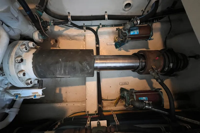 Renegade Yacht Photos Pics Engine room of 2001 Hatteras 65 Convertible yacht, showing mechanical components and piping.