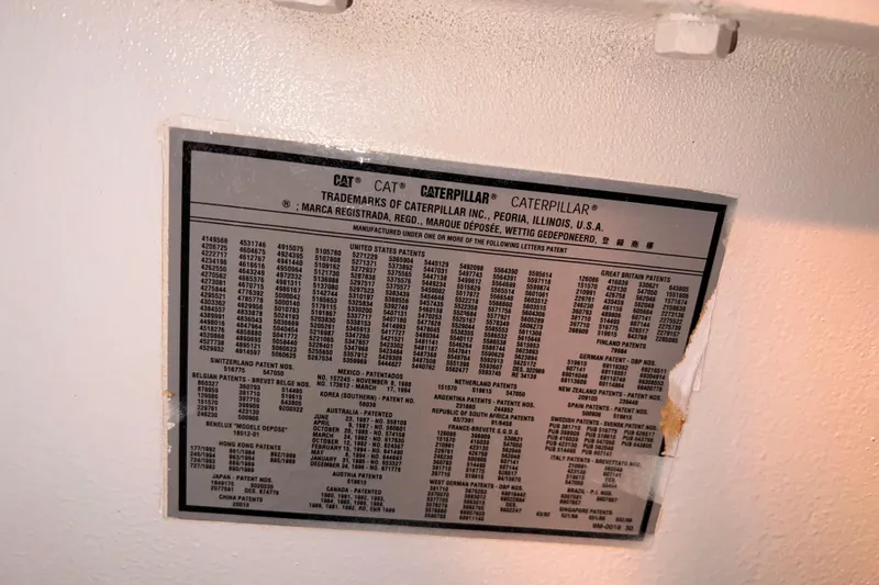 Renegade Yacht Photos Pics Caterpillar patent information plaque on a 2001 Hatteras 65 Convertible yacht.