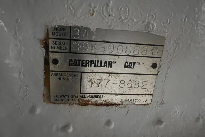 Renegade Yacht Photos Pics Caterpillar engine plate on 2001 Hatteras 65 Convertible, showing model and serial numbers.