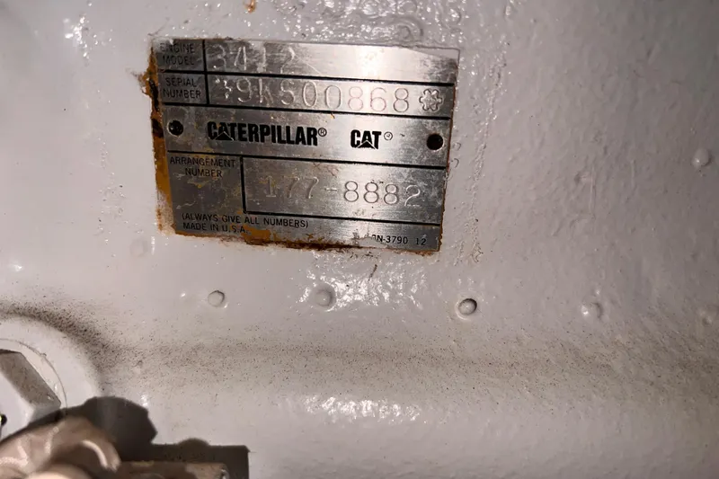 Renegade Yacht Photos Pics Caterpillar engine plate on 2001 Hatteras 65 Convertible, showing model and serial numbers.