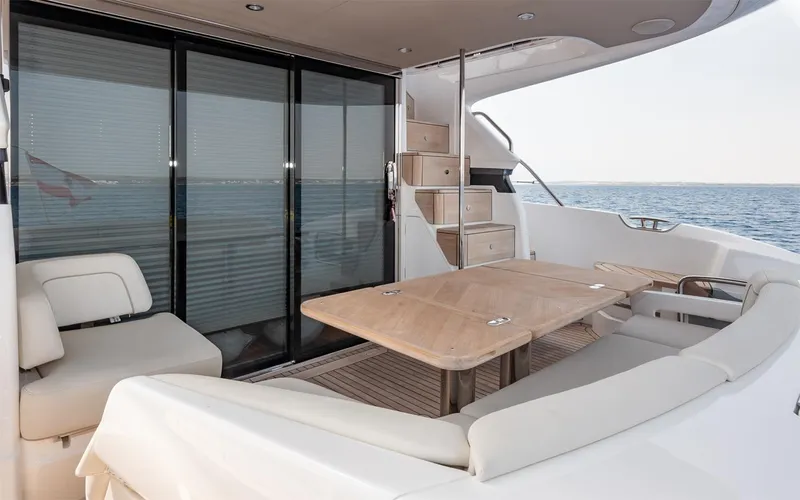  Yacht Photos Pics Luxurious 2023 Princess 45 yacht deck with seating and ocean view.