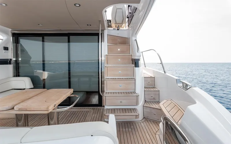  Yacht Photos Pics Luxurious 2023 Princess 45 yacht interior with wooden deck and ocean view.