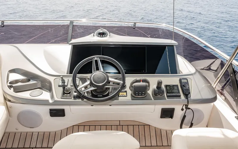  Yacht Photos Pics Helm of 2023 Princess 45 yacht with modern controls and steering wheel.