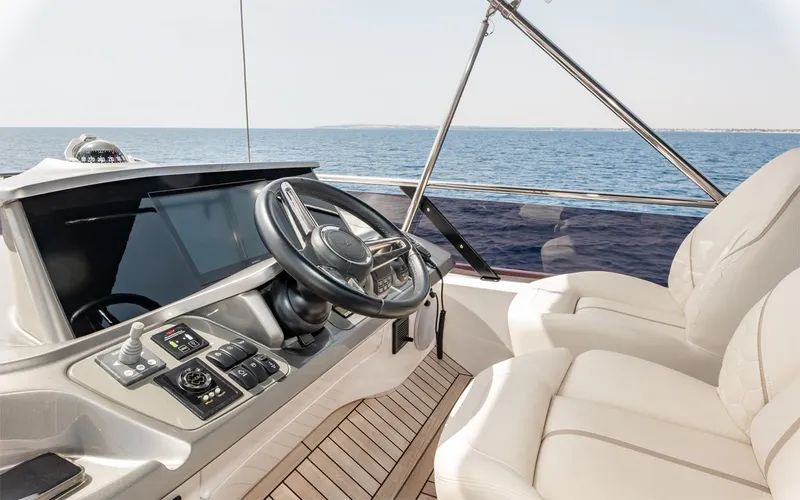  Yacht Photos Pics Luxurious 2023 Princess 45 yacht helm with leather seating and ocean view.