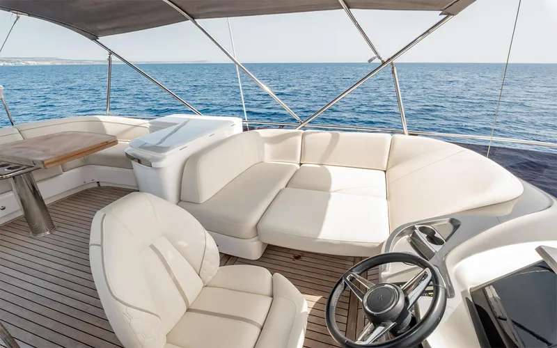  Yacht Photos Pics Luxurious 2023 Princess 45 yacht interior with white seating and ocean view.