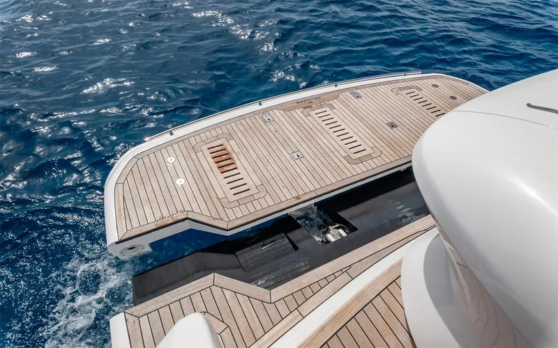  Yacht Photos Pics Luxury yacht Princess 45, 2023 model, with teak swim platform on open sea.