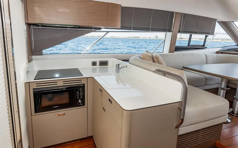  Yacht Photos Pics Modern kitchen area on 2023 Princess 45 yacht with ocean view.