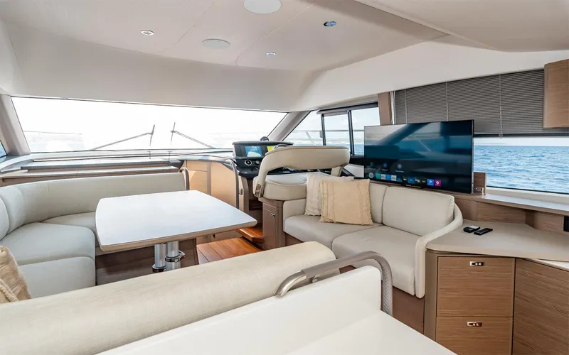  Yacht Photos Pics Luxurious interior of 2023 Princess 45 yacht with modern seating and large windows.