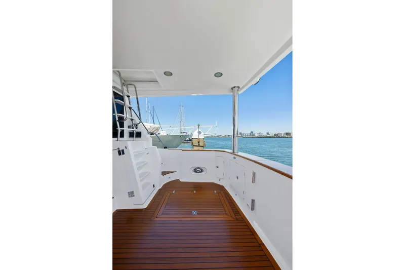 Ds Gatos Yacht Photos Pics Spacious deck of 1999 Symbol 558 yacht with wooden flooring and ocean view.