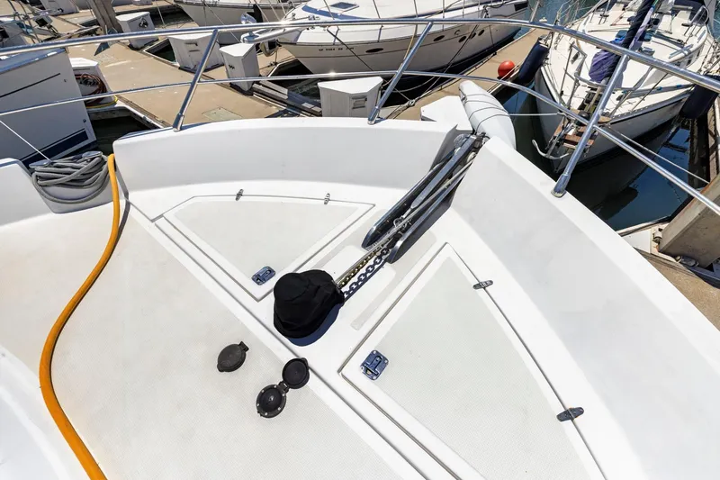 Ds Gatos Yacht Photos Pics Bow of a 1999 Symbol 558 yacht docked at a marina.