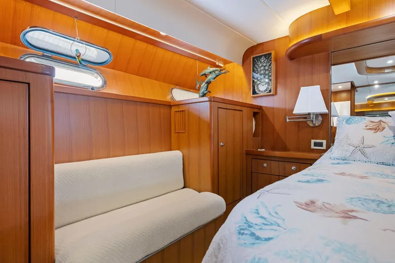 Ds Gatos Yacht Photos Pics Luxurious 1999 Symbol 558 yacht cabin with wooden interior and nautical-themed decor.