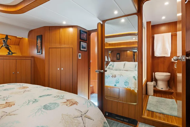Ds Gatos Yacht Photos Pics Luxurious 1999 Symbol 558 yacht cabin with wood paneling and ensuite bathroom.