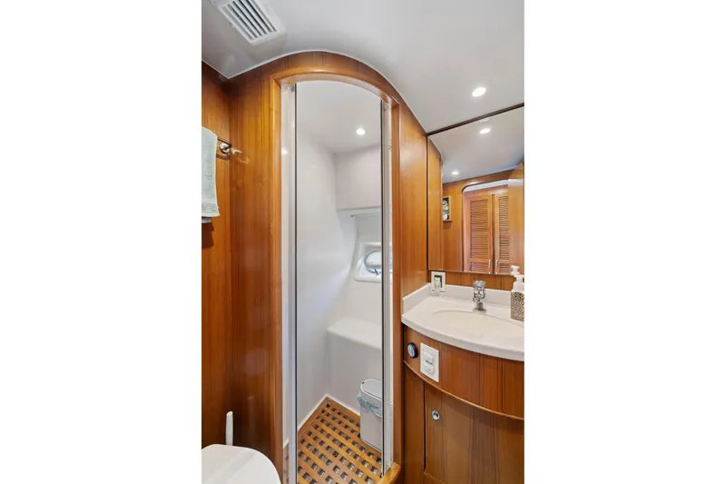 Ds Gatos Yacht Photos Pics Luxurious yacht bathroom with wood accents, shower, and vanity, Symbol 558, 1999 model.